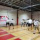 New fencers try out fencing for the first time at our grand opening.