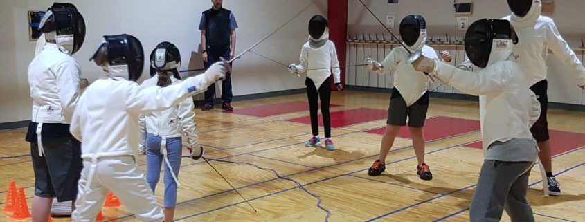 HSS Youth fencers play a fencing game