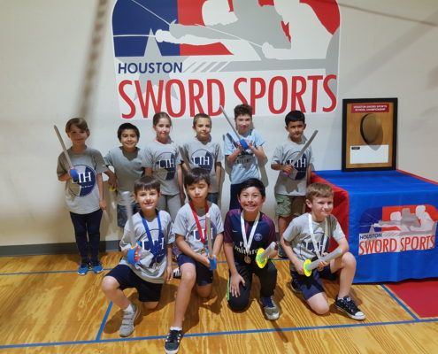 LIH fencers with their medals and foam swords