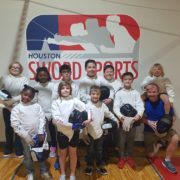 July 2018 Camp Participants pose by the Houston Sword Sports logo