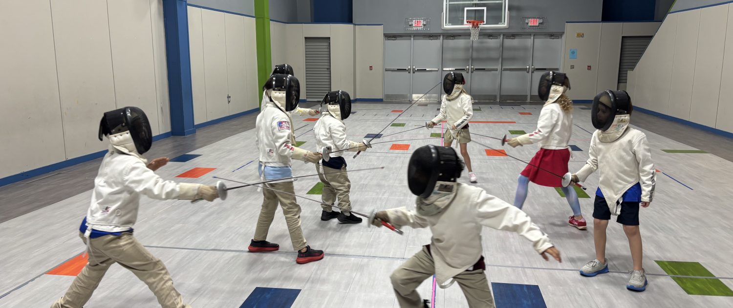 Children fence in the gym at Parkway Christian Academy